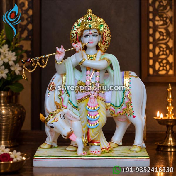 marble statue of lord krishna with cow